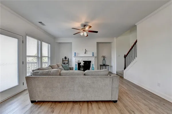 a living room with furniture and a fireplace