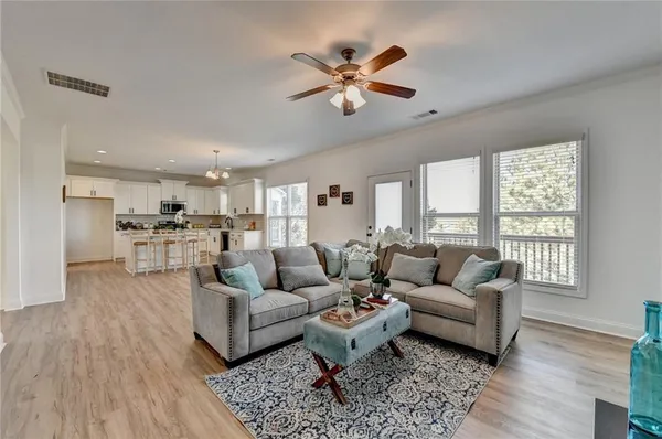 a living room with furniture and a large window