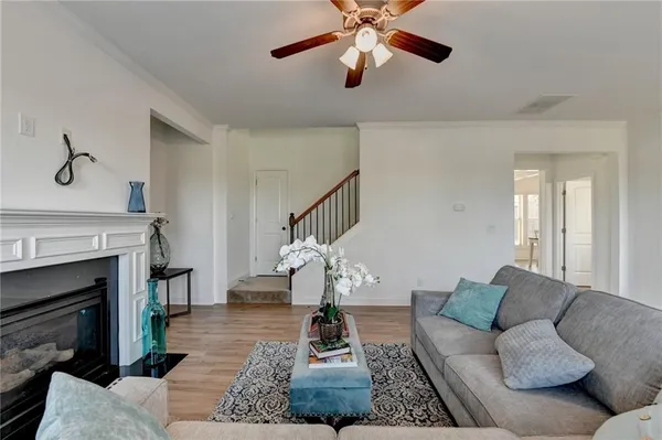 a living room with furniture and a fireplace