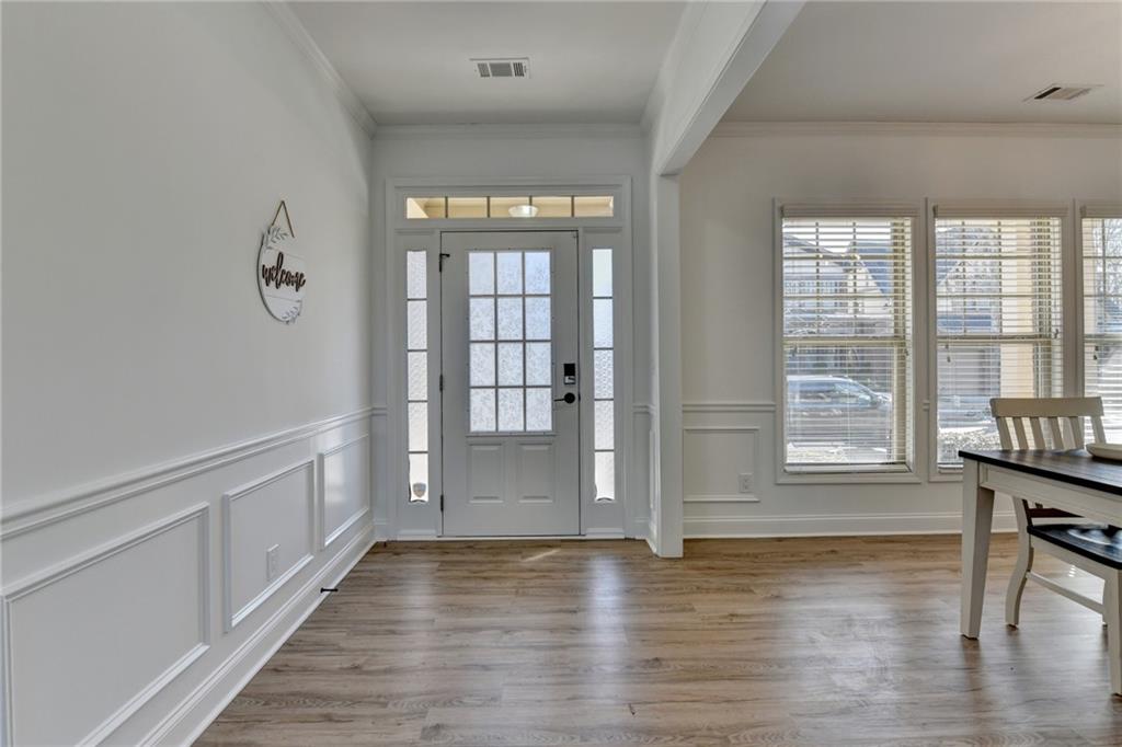 3670 Baxley Ridge Drive Suwanee, GA 30024 - Photo 3 of 64 a view of room with window and wooden floor