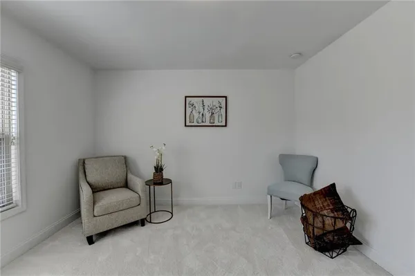 a bed room with a bed and a chair