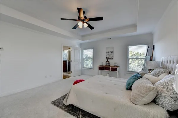 a bathroom with double vanity and a mirror