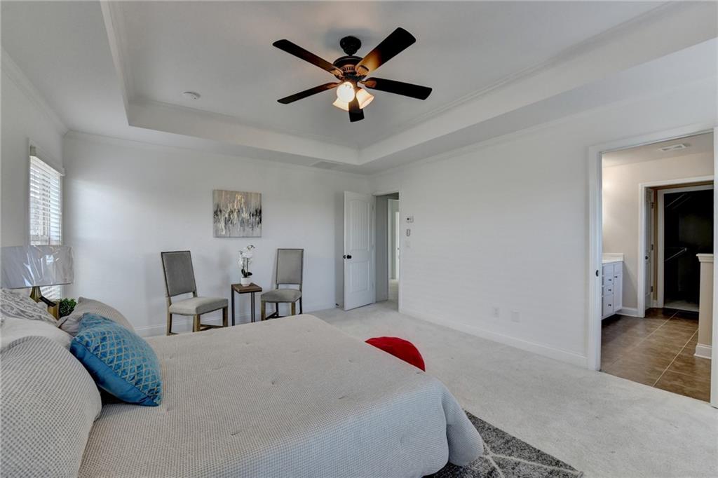 3670 Baxley Ridge Drive Suwanee, GA 30024 - Photo 39 of 64 a bed room with a bed and a chair