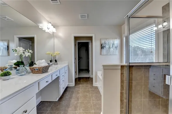 a bathroom with a toilet a sink and a mirror