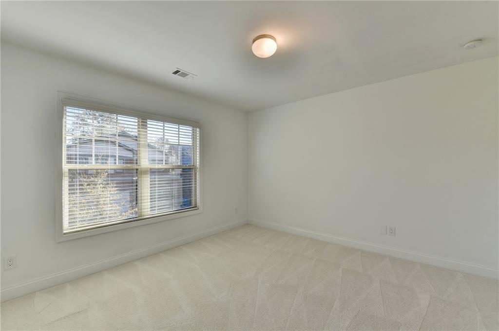 3670 Baxley Ridge Drive Suwanee, GA 30024 - Photo 45 of 64 an empty room with a window
