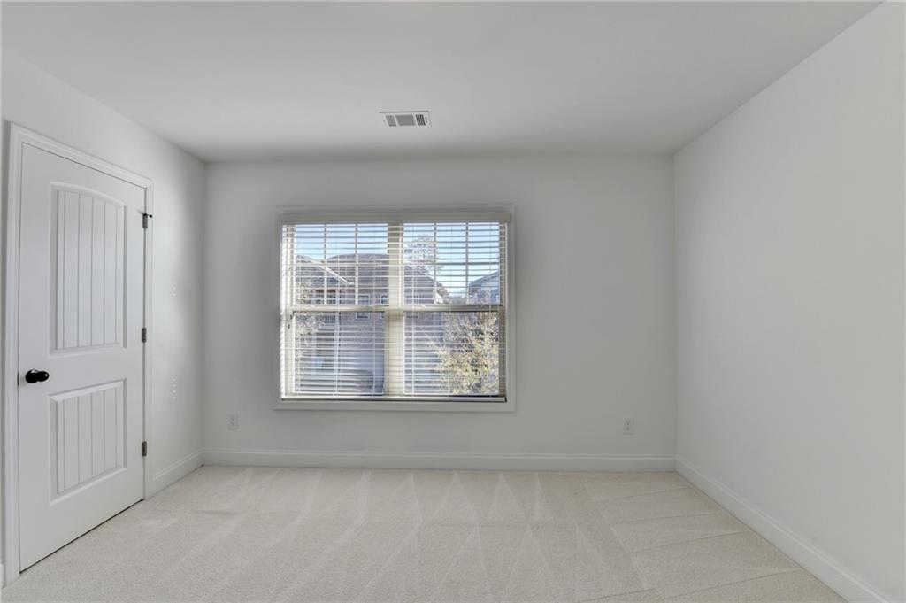 3670 Baxley Ridge Drive Suwanee, GA 30024 - Photo 46 of 64 an empty room with a window