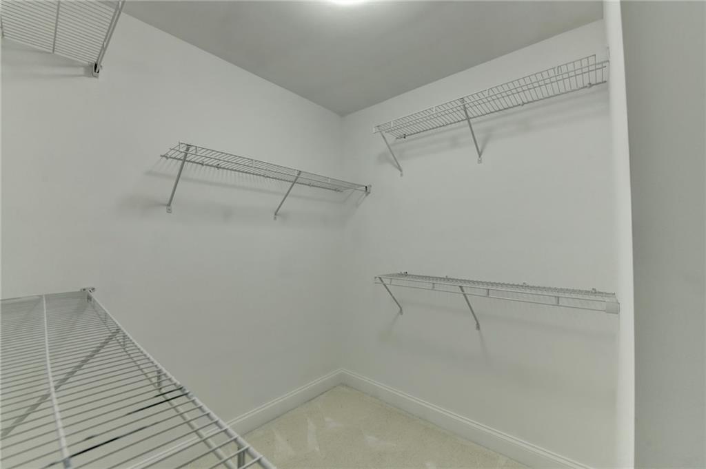 3670 Baxley Ridge Drive Suwanee, GA 30024 - Photo 51 of 64 a view of a room with racks on the wall