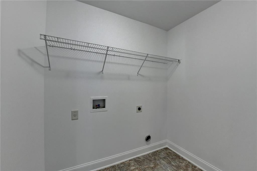 3670 Baxley Ridge Drive Suwanee, GA 30024 - Photo 52 of 64 a view of a room with racks on the wall