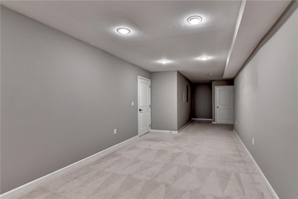 3670 Baxley Ridge Drive Suwanee, GA 30024 - Photo 58 of 64 an empty room with window and pillar in it