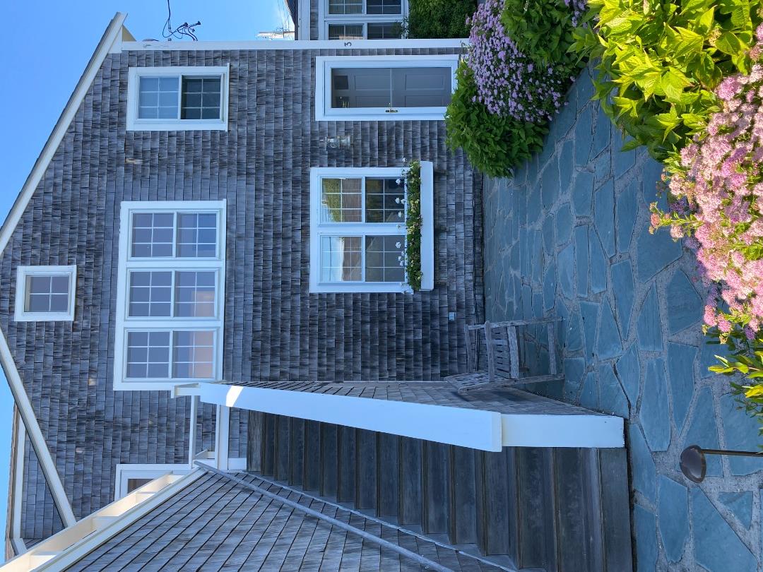 76 Baxter Road Nantucket, MA 02554 - Photo 7 of 25 a front view of a house with a yard