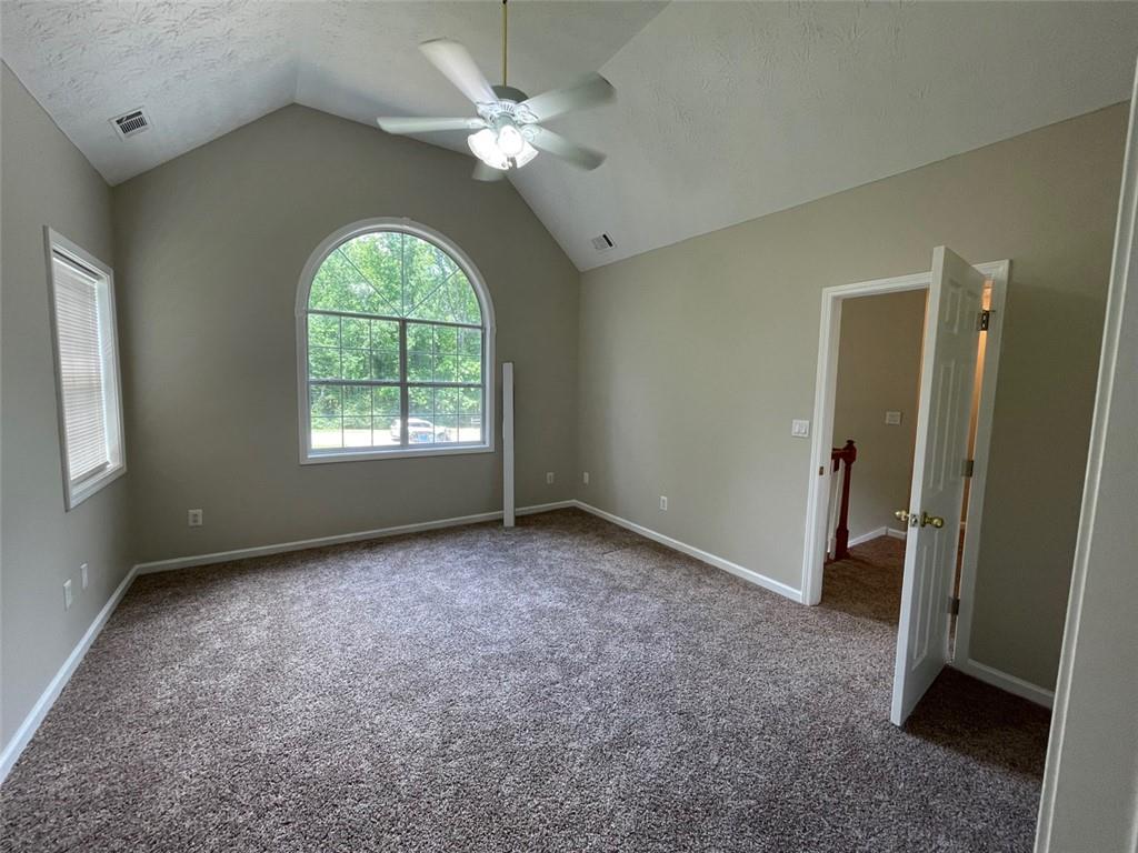 55 The Falls Boulevard Covington, GA 30016 - Photo 14 of 20 wooden floor in an empty room with a window