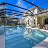 a view of a swimming pool with a patio