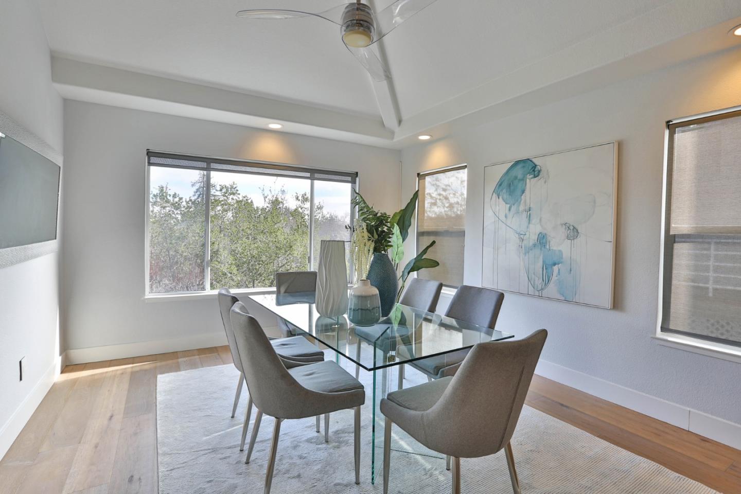 22344 McClellan Road Cupertino, CA 95014 - Photo 11 of 42 a dining room with furniture a chandelier and wooden floor