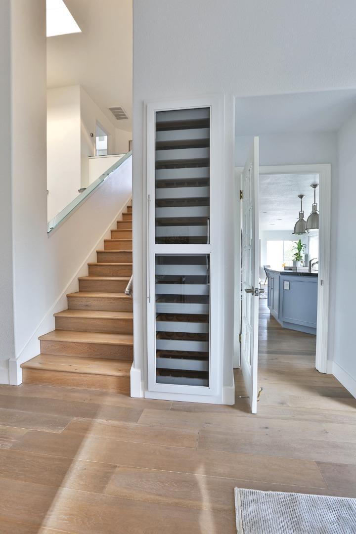 22344 McClellan Road Cupertino, CA 95014 - Photo 13 of 42 a view of a hallway to a bedroom and stairs
