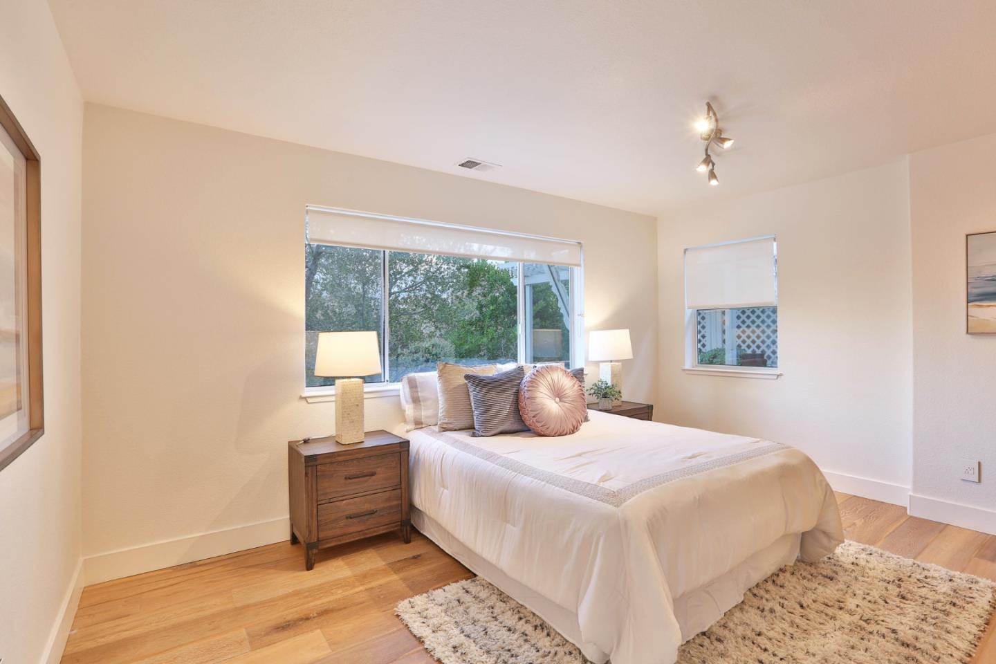 22344 McClellan Road Cupertino, CA 95014 - Photo 19 of 42 a bedroom with a large bed and a window