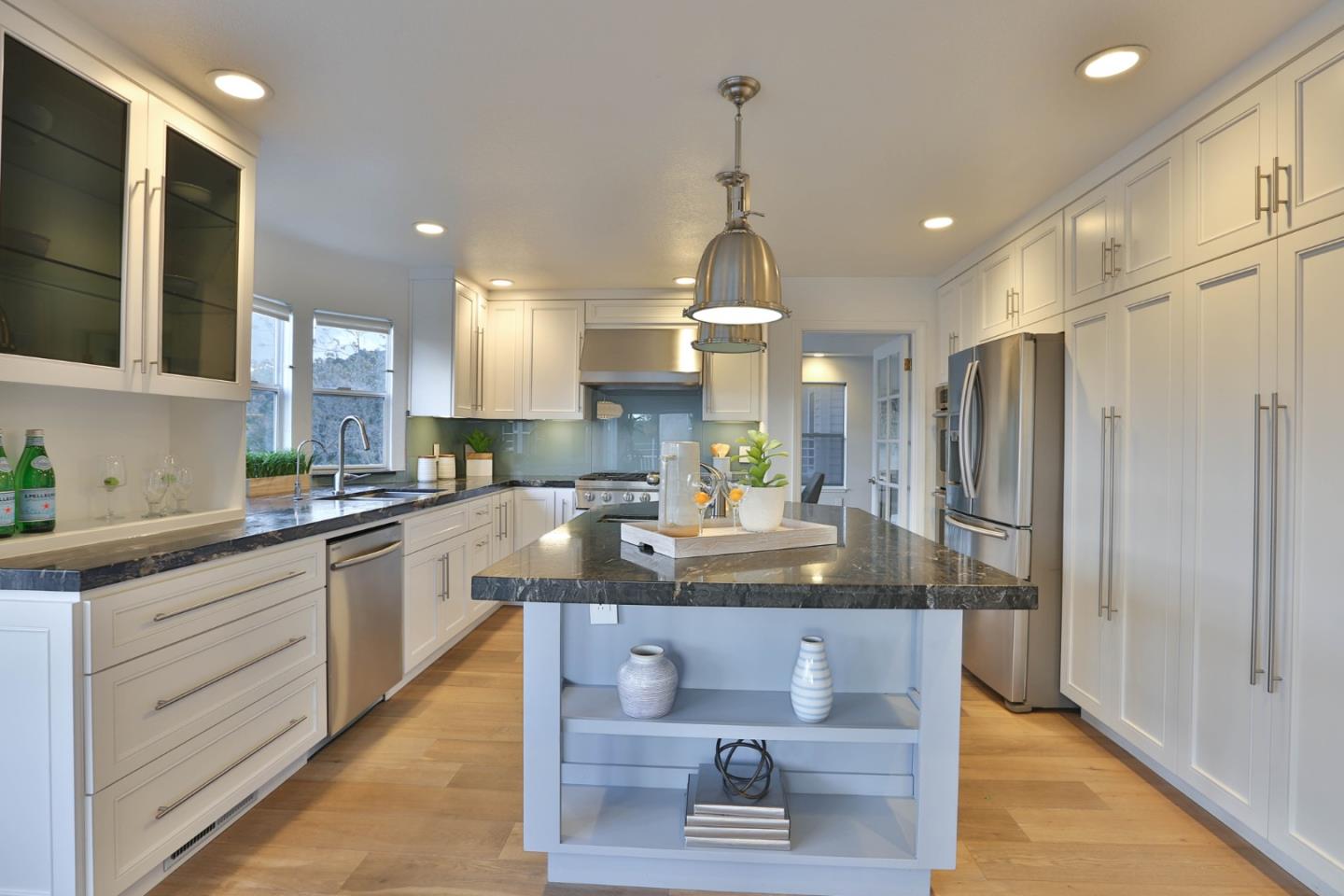 22344 McClellan Road Cupertino, CA 95014 - Photo 2 of 42 a kitchen with kitchen island granite countertop stainless steel appliances a sink stove and refrigerator
