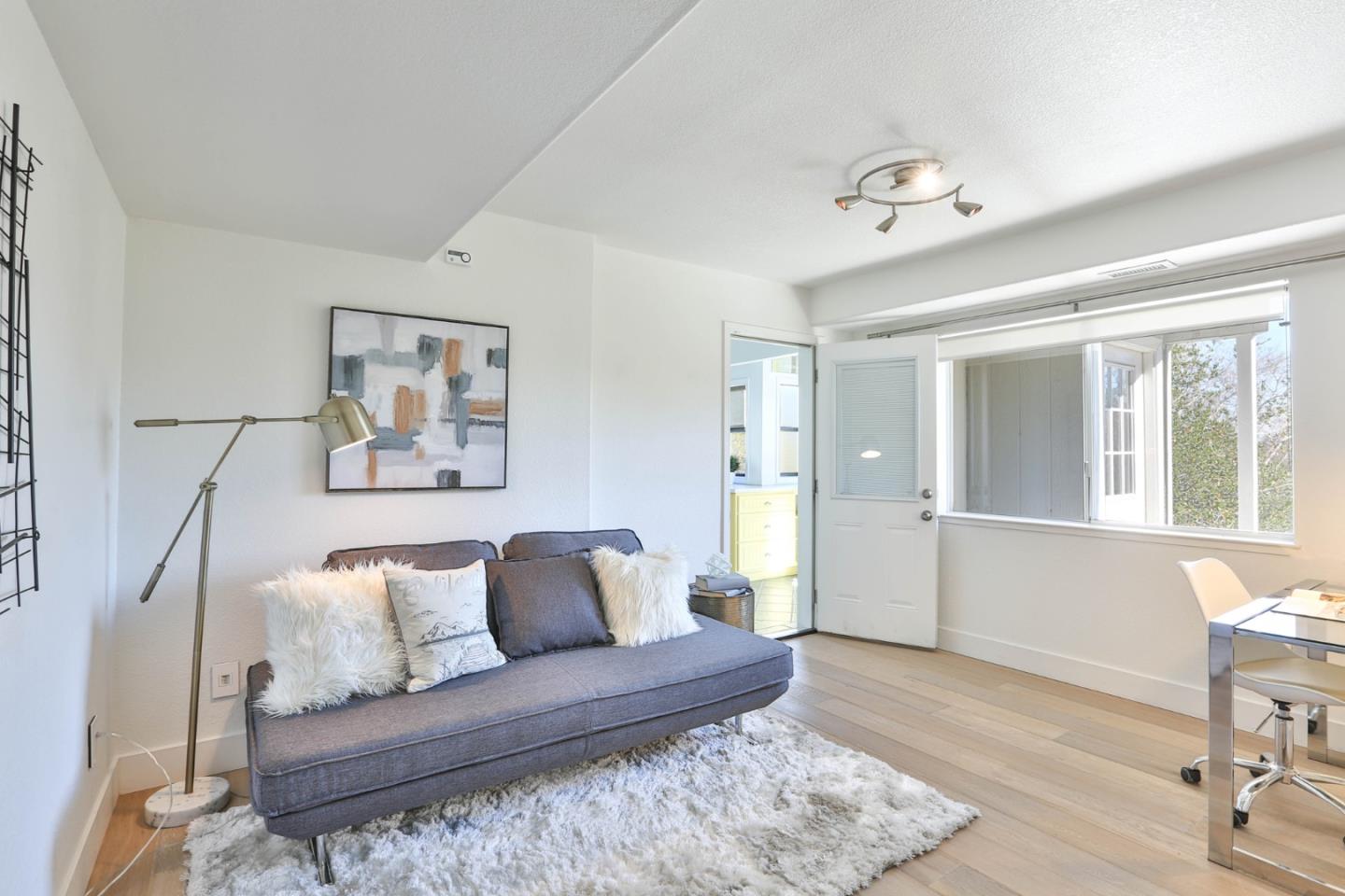 22344 McClellan Road Cupertino, CA 95014 - Photo 21 of 42 a living room with furniture and wooden floor