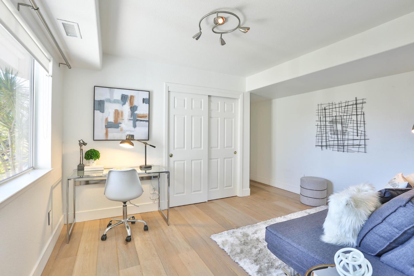 22344 McClellan Road Cupertino, CA 95014 - Photo 22 of 42 a living room with furniture a window and a table