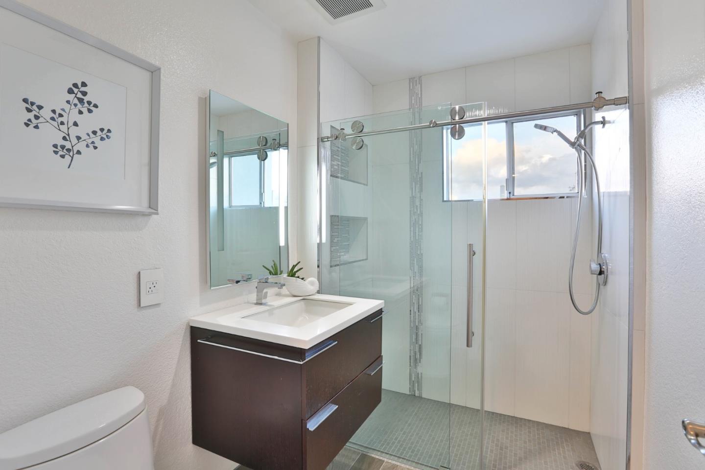22344 McClellan Road Cupertino, CA 95014 - Photo 25 of 42 a bathroom with a sink toilet and shower