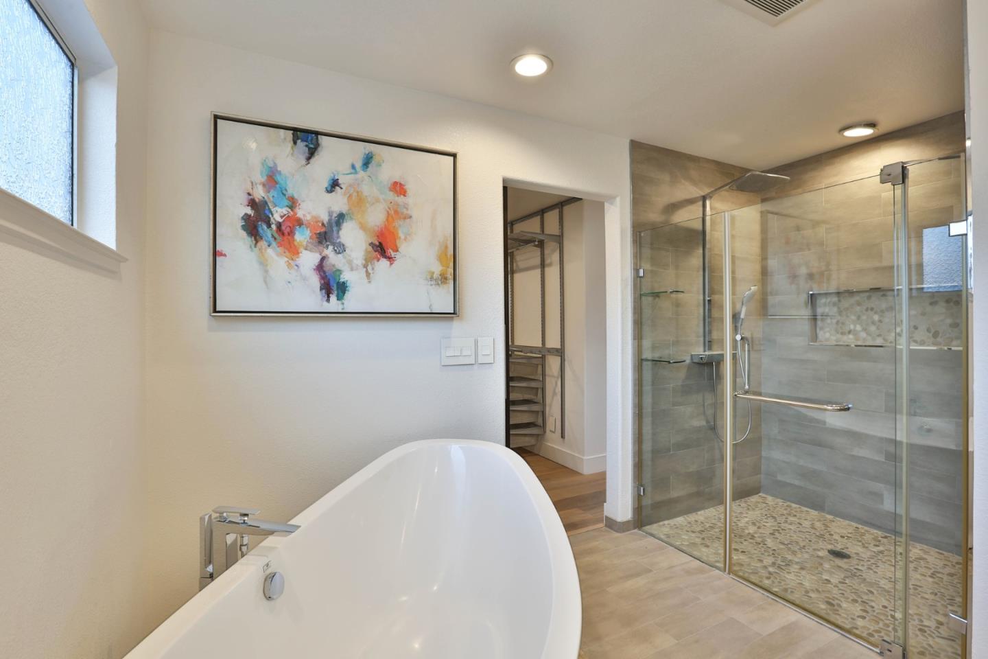 22344 McClellan Road Cupertino, CA 95014 - Photo 28 of 42 a bathroom with a bathtub and a shower