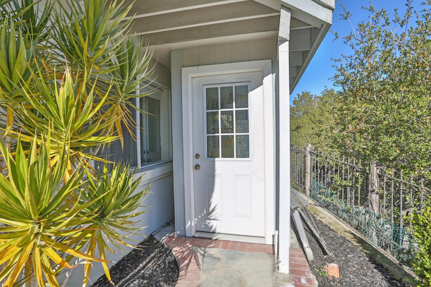 22344 McClellan Road Cupertino, CA 95014 - Photo 31 of 42 a view of a door and front of a house