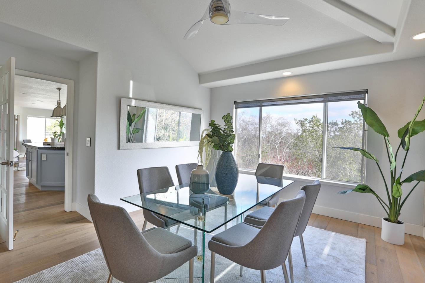 22344 McClellan Road Cupertino, CA 95014 - Photo 8 of 42 a dining room with furniture wooden floor and a potted plant