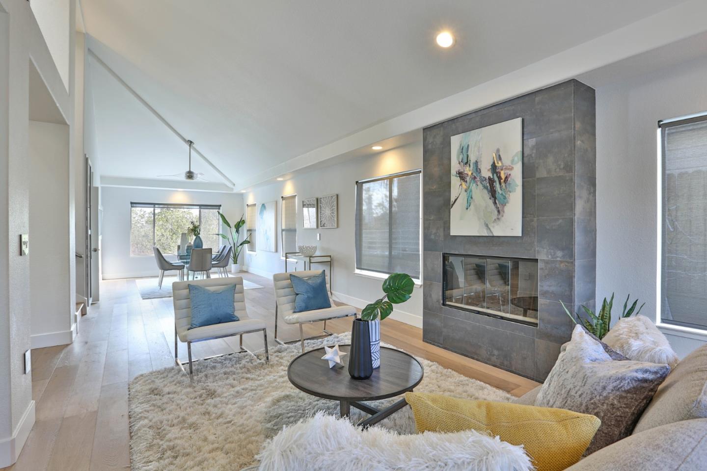 22344 McClellan Road Cupertino, CA 95014 - Photo 10 of 42 a living room with furniture and a fireplace