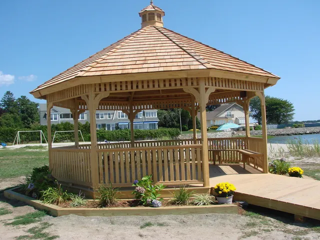 a view of a lake with boats and trees in the background