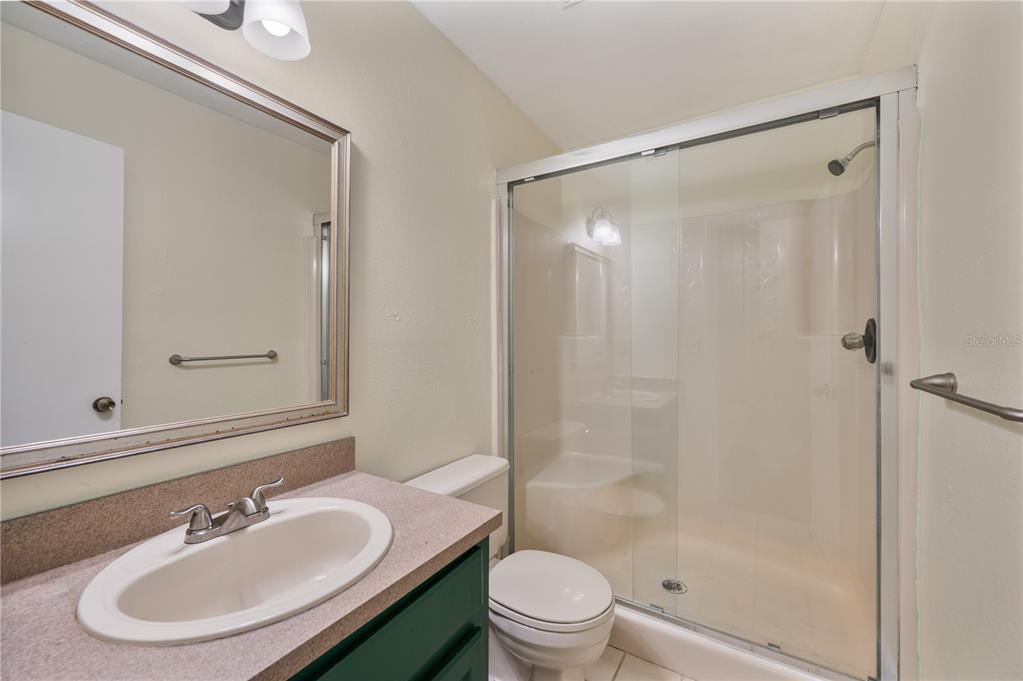 4231 Oak Loop, Unit 51 Mulberry, FL 33860 - Photo 23 of 29 a bathroom with a sink and a mirror
