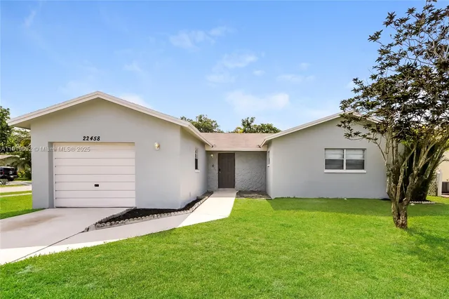 a backyard of a house with garage