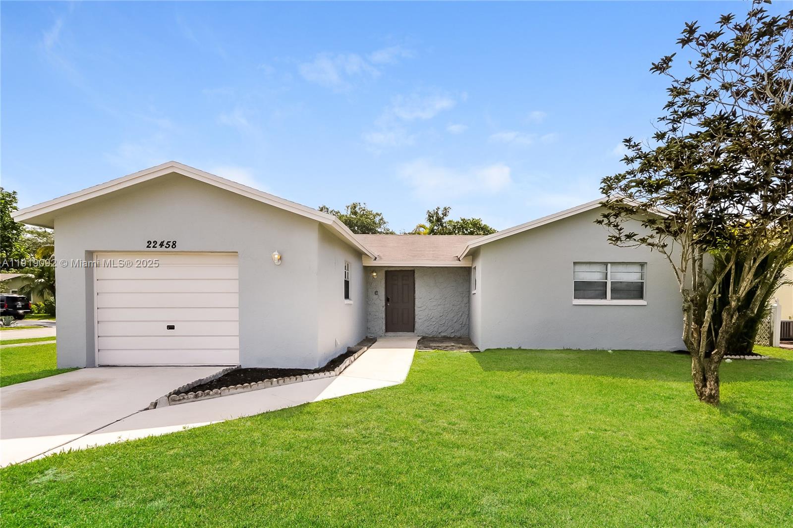 a backyard of a house with garage