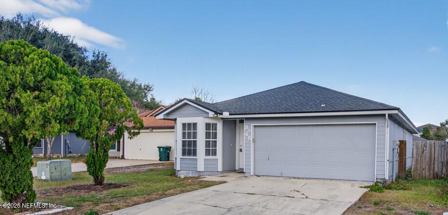 8745 Buzz Court Jacksonville, FL 32216 - Photo 20 of 23 a front view of a house with a yard
