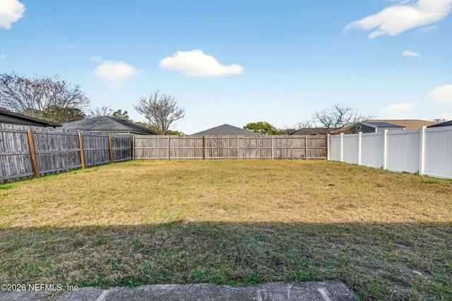 a swimming pool with an outdoor space and seating