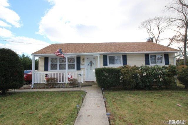 50 West Adams Street East Islip, NY 11730 - Photo 1 of 1 a front view of a house with swimming pool having outdoor seating