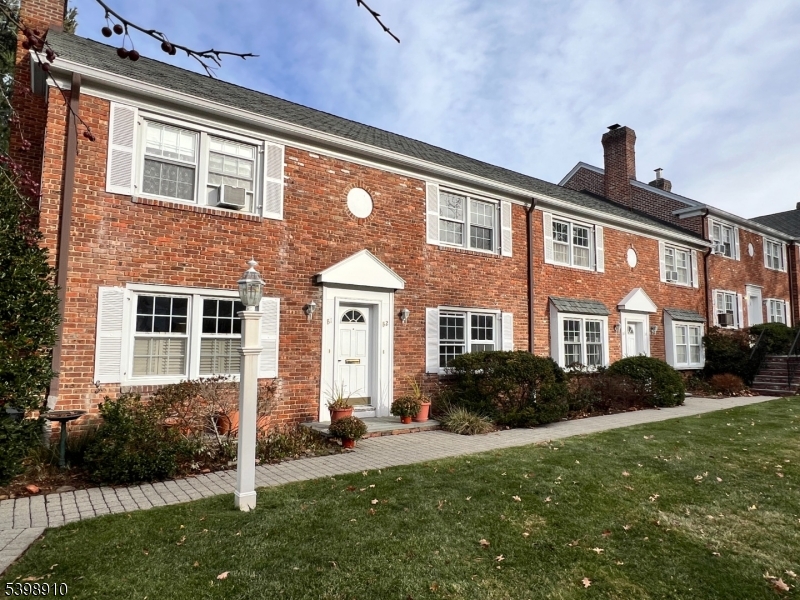 15 Norwood Avenue, Unit B2 Summit, NJ 07901 - Photo 13 of 18 a front view of a house with garden