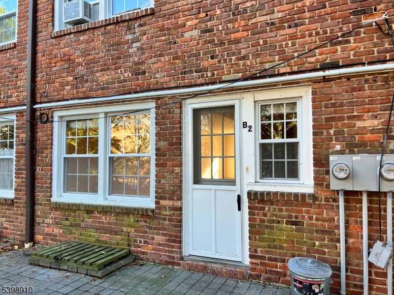 15 Norwood Avenue, Unit B2 Summit, NJ 07901 - Photo 14 of 18 a front view of a building with a garden