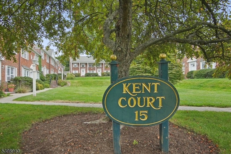 15 Norwood Avenue, Unit B2 Summit, NJ 07901 - Photo 17 of 18 a sign board with a play ground in the back yard