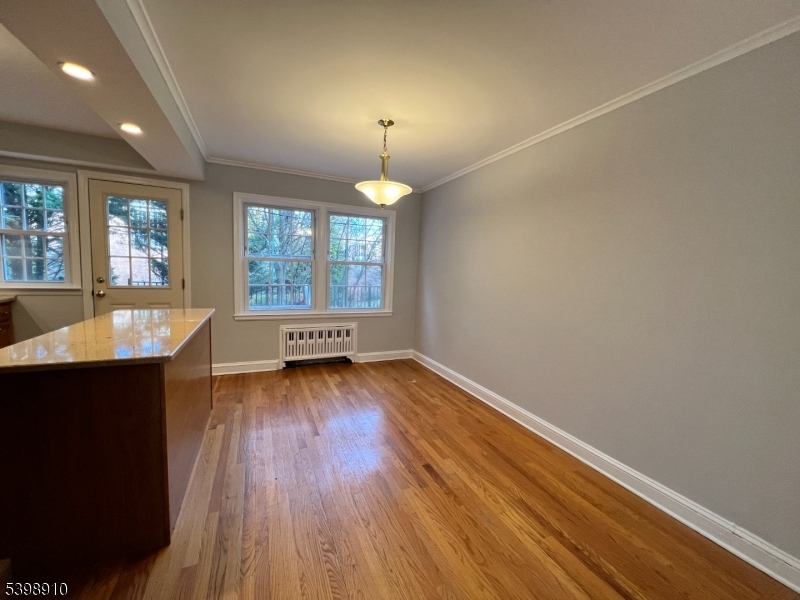 15 Norwood Avenue, Unit B2 Summit, NJ 07901 - Photo 4 of 18 a view of a room with wooden floor and a window