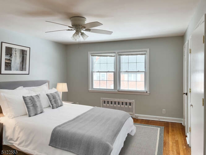 15 Norwood Avenue, Unit B2 Summit, NJ 07901 - Photo 7 of 18 a bedroom with a bed and a window