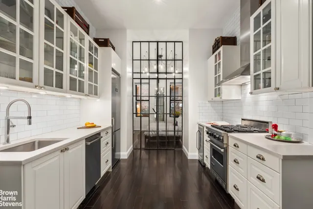 a kitchen with stainless steel appliances granite countertop a stove and a sink