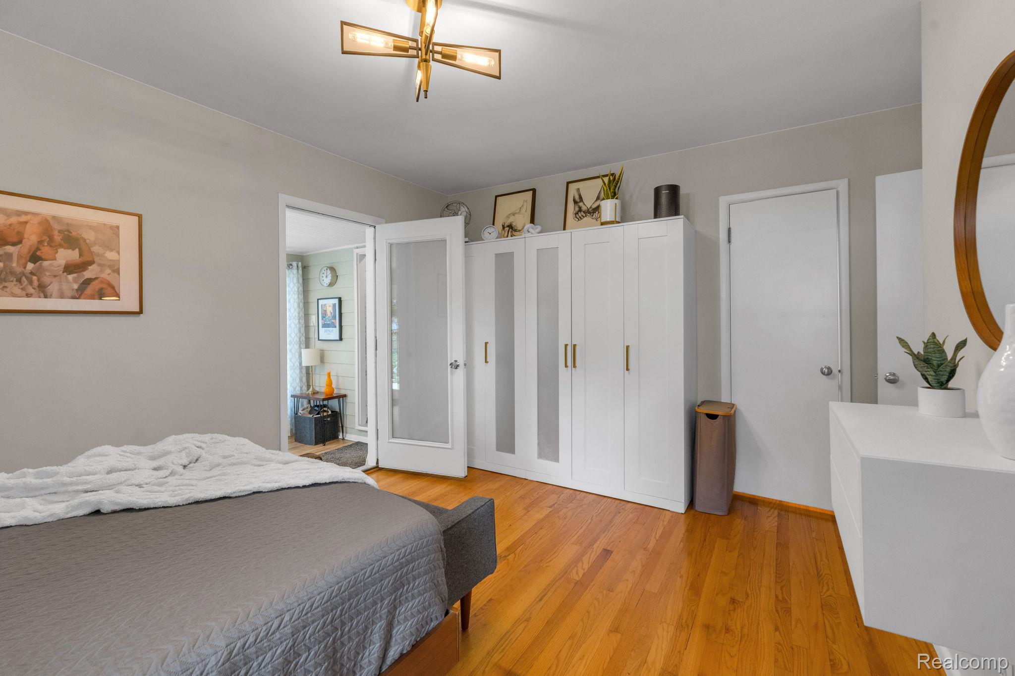 21 Devonshire Road Pleasant Ridge, MI 48069 - Photo 24 of 35 Hardwood flooring throughout, complemented by a modern brass ceiling light fixture