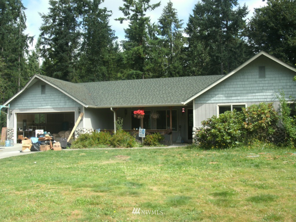 5528 133rd Avenue Southwest Rochester, WA 98579 - Photo 1 of 7 a view of a house with yard and sitting area