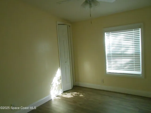 a view of an empty room and window