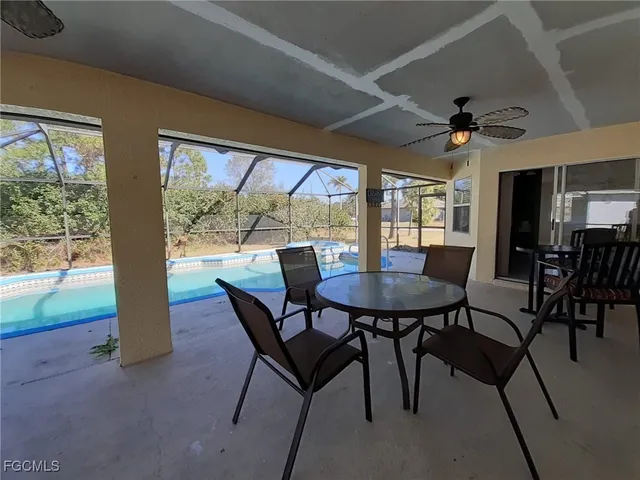 a view of a livingroom with dining room and furniture