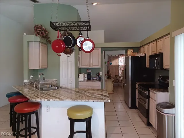 a stove top oven sitting inside of a kitchen