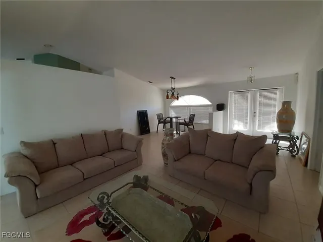 a view of a dining room with furniture and window