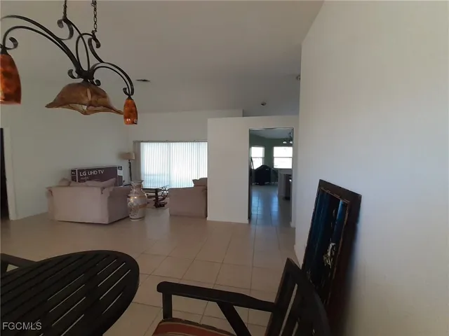 a bedroom with furniture and a wooden floor