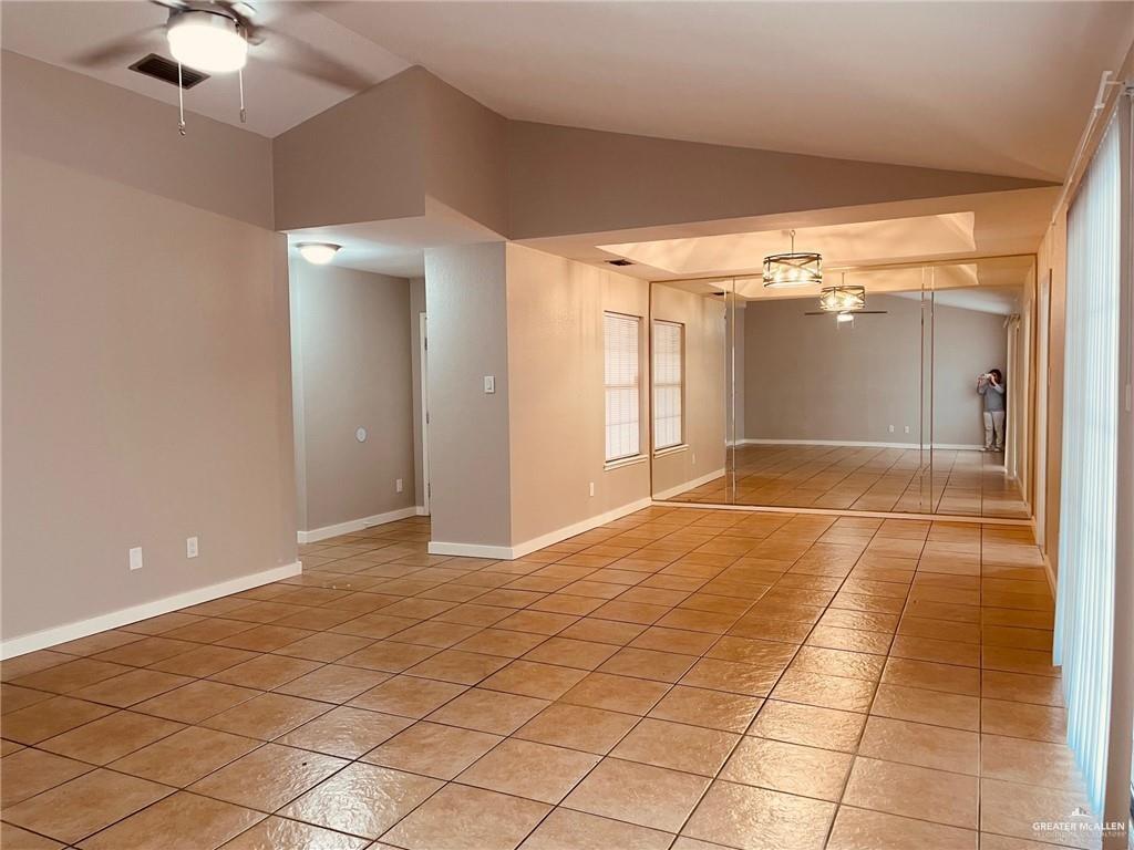 1206 Bluebird Avenue McAllen, TX 78504 - Photo 11 of 20 a view of a livingroom with a chandelier