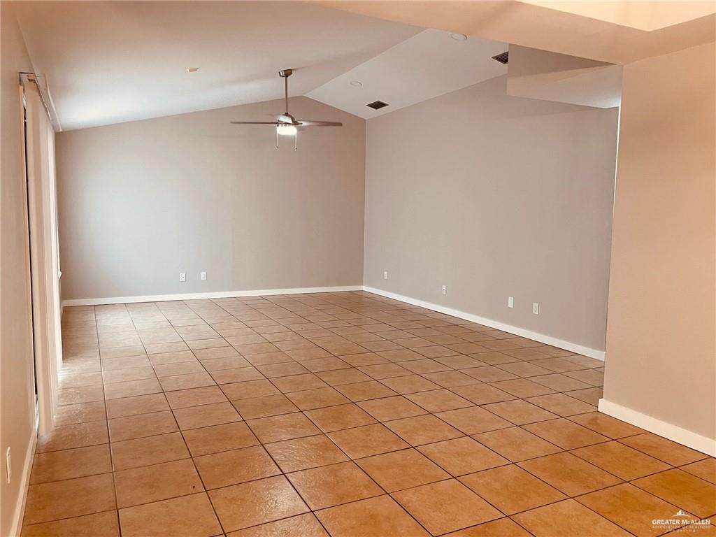 1206 Bluebird Avenue McAllen, TX 78504 - Photo 3 of 20 an empty room with white walls and tiles