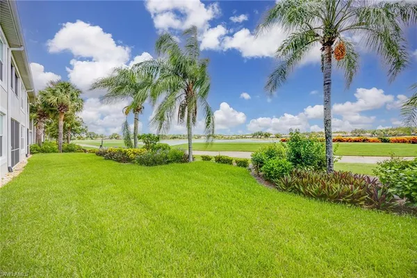 a view of a lake with houses in the background